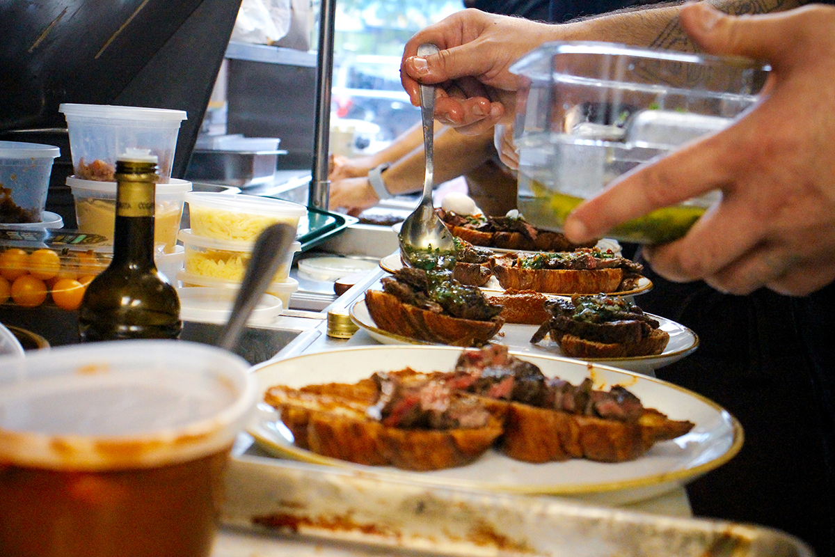 Farmhouse kitchen team thoughtfully preparing food